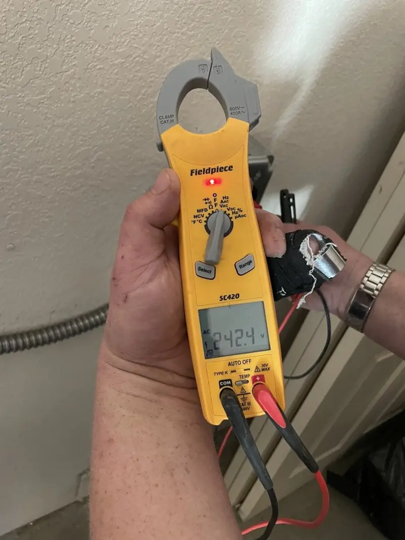 Voltage testing with clamp meter during Aluminum Wiring Replacement in Marshall